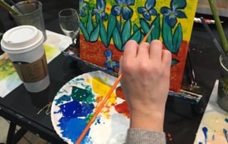 Meghan Slipka painting at an easel