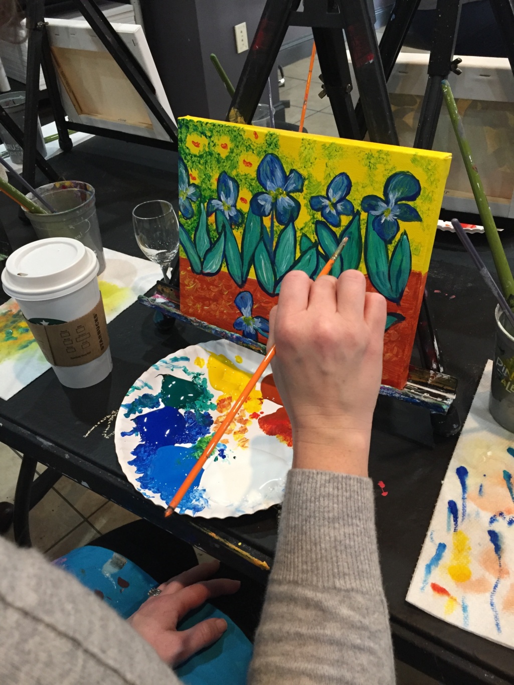 Meghan Slipka painting at an easel