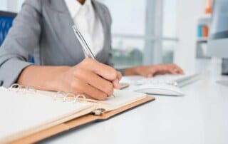Business woman writing